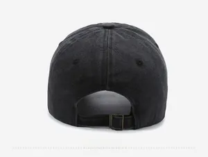 Rear view of washed denim baseball cap with an adjustable bronze metal buckle