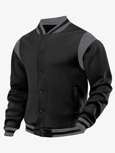 Close-up of ribbed knit collar and grey patchwork sleeves on black varsity jacket