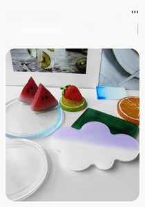 Detailed view of colorful acrylic coasters in cloud, square and citrus fruit shapes
