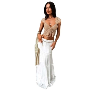 Bohemian set with beige lace-up crop top and white tiered maxi skirt for summer