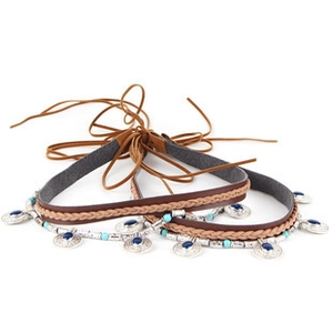 Detail of bohemian braided leather belt with silver coins, blue beads and tassels