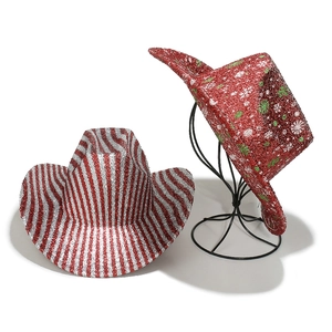 Detail view of festive glittery red and white striped cowboy hats with snowflake patterns