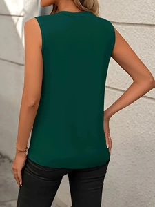 Back view of a loose dark green sleeveless tank top shirt for women on a model