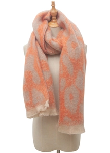 Detail of soft brushed leopard print scarf in orange and beige with delicate fringe edges