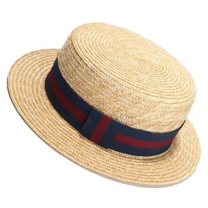 Classic summer straw boater hat with natural weave and red-blue striped ribbon band
