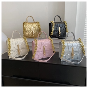 Five textured PU leather crossbody bags in gold, black, white, pink and silver with chains