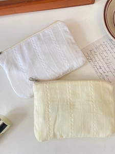 Quilted cotton cosmetic bags with lace trim and vertical stripes in cream and white