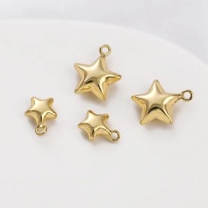 Detailed view of 14K gold plated star pendants for DIY jewelry making and crafts