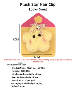 Detail of yellow plush star hair clip with pink striped bow and rabbit fur texture