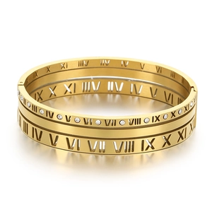 Polished gold roman numeral hollow bangle with pavé diamonds for a luxury aesthetic look