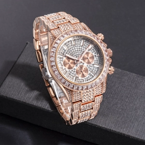 Macro shot of rose gold iced-out watch showing diamond encrusted dial and sub-dials