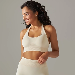 Seamless knit halter neck sports bra and high-waist leggings set in creamy beige white