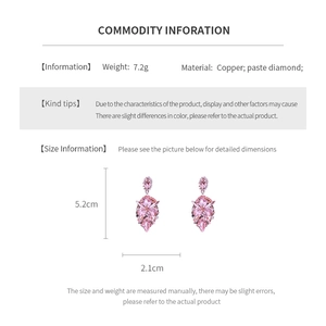 Detail view of pink rhinestone teardrop earrings with dimensions and material info