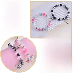 Detail showing natural stone couple bracelets with magnet heart and wizard hat charms