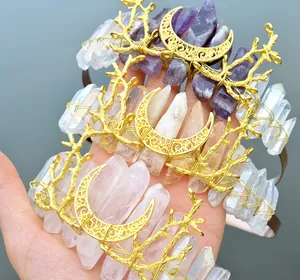 Detail of natural crystal headbands featuring gold metal moon and antler branch motifs