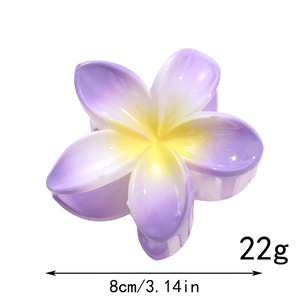 Detail of purple frangipani flower hair claw showing 8cm size and 22g weight specifications
