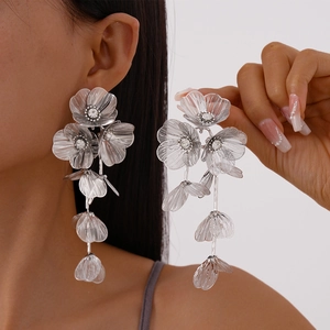 Silver flower tassel drop earrings with sparkling rhinestones and layered metal petals