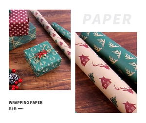 Assorted Christmas wrapping paper rolls featuring elk, dots and grid patterns on kraft paper