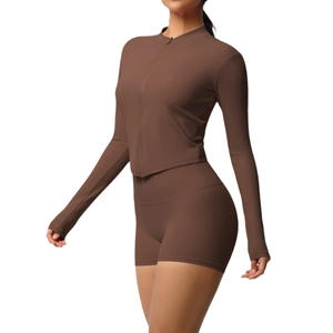 Women's brown yoga set with long sleeve zipper top and high waist sports shorts