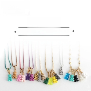 Detail of colorful resin gummy bear pendants with sparkling rhinestone bails for necklaces