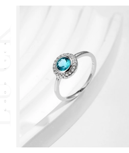 Detailed side view of an S925 silver ring featuring a round blue stone and white zircon