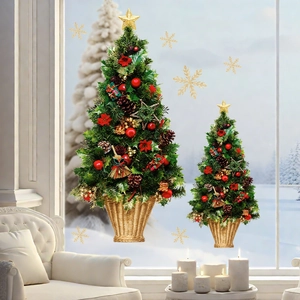 Detailed view of Christmas tree window stickers with festive red berries and gold stars