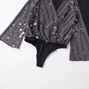 Sparkly grey sequin bodysuit with a plunging V-neck and stylish flared long sleeves