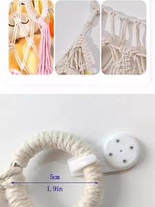 Detail of hand-woven cotton net storage with pink tassels and a metal hanging ring