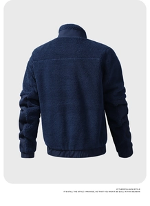 Detail of navy teddy fleece jacket featuring reinforced elbow patches and stand collar