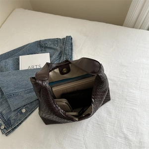 Retro dark brown woven leather bucket bag with large capacity and magnetic buckle