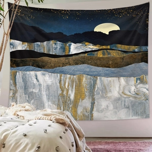 Bedroom wall decor detail showing a mountain and starry sky tapestry in blue and gold