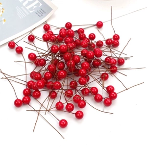 Vibrant red artificial berries with flexible brown stems for DIY crafts and home decor