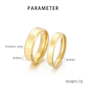 Polished stainless steel couple rings in gold plating with elegant beveled edges