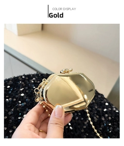 Macro shot of an octagonal gold metal mini bag featuring a polished mirror surface