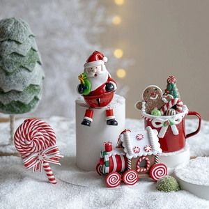 Christmas ornaments set with Santa bells and gingerbread house on a snowy festive backdrop