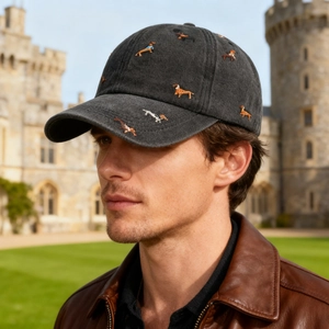 Washed dark grey baseball cap with colorful dog embroidery and a vintage distressed finish