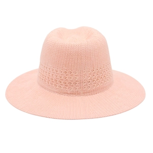 Close-up of pink Fedora sun hat with elegant hollow-out crochet pattern on crown