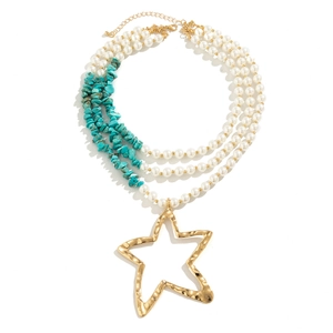 Macro view of multi-layer necklace with blue turquoise beads and gold star pendant