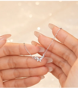 Close-up of S925 sterling silver butterfly pendant with micro-set sparkling cubic zirconia