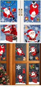 Close-up of Santa Claus and snowflake static stickers on a festive window pane