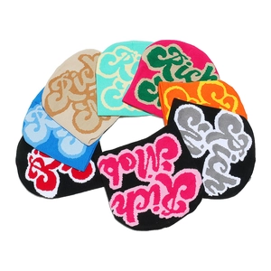 Multi-colored knitted beanies featuring Rich Mob jacquard lettering for men and women