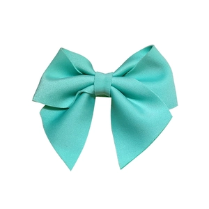 Mint green ribbed ribbon bow hair accessory featuring vibrant color and high texture detail