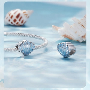 Close-up of s925 silver shell charms with blue enamel finish for DIY jewelry bracelets