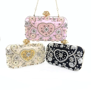 Three elegant evening clutch bags with floral bead embroidery and sparkling rhinestones