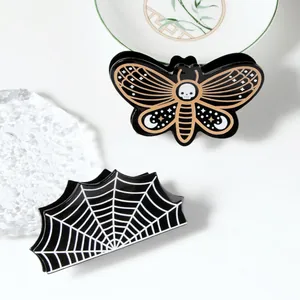 Gothic Halloween hair claws featuring skull moth and spider web patterns for women