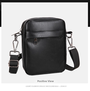 Detailed side view of black PU leather crossbody bag featuring pebble texture and zipper