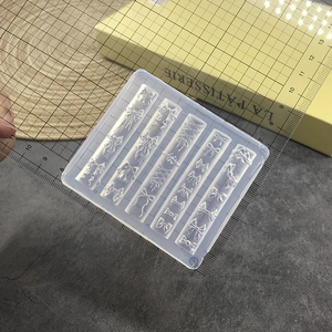 Bow tie silicone nail art mold with scale ruler for size reference and DIY crafts