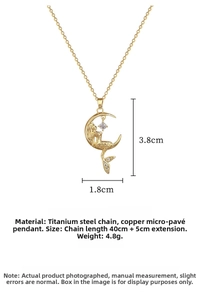 Macro detail of mermaid moon pendant showing size measurements and cubic zirconia inlay