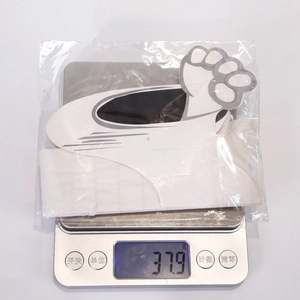 Weight measurement of small claw print car stickers in a clear plastic package