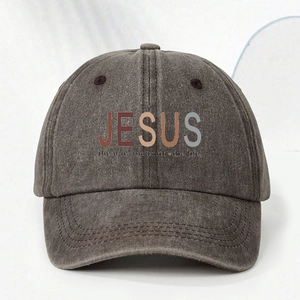 Close-up of washed cotton texture and JESUS slogan printing on the baseball cap